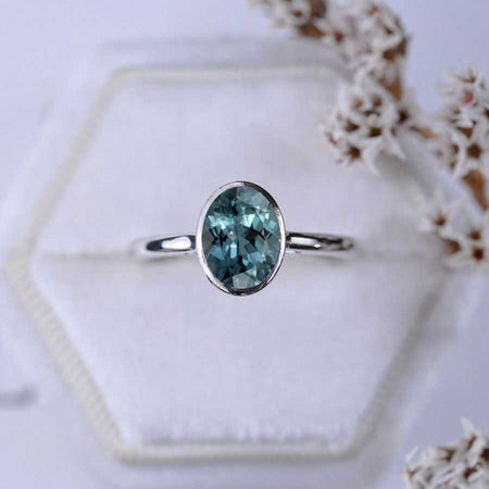 3 Carat Oval Teal Sapphire Bezel Set Gold Engagement Ring