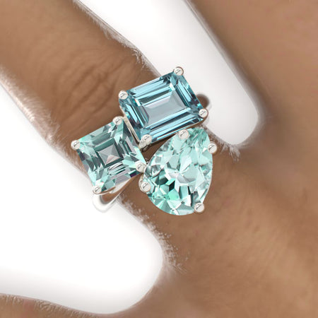 3 Carat Emerald Cut with Pear Cut Paired with 2 Carat Asscher Cut Mint Sapphire Three-Stone North-South Engagement Ring