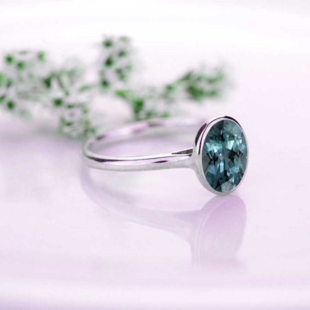 3 Carat Oval Teal Sapphire Bezel Set Engagement Ring